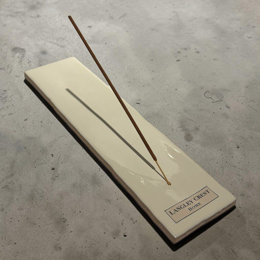 Oyster Tile incense burner, long oyster-white glossy tile with chiseled edge holding one incense stick